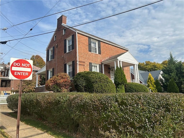 4735 Stanton Ave, Stanton Heights, PA 15201 - view of home's exterior featuring brick siding and a chimney