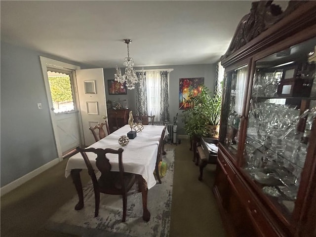 4735 Stanton Ave, Stanton Heights, PA 15201 - carpeted dining room with baseboards and a chandelier