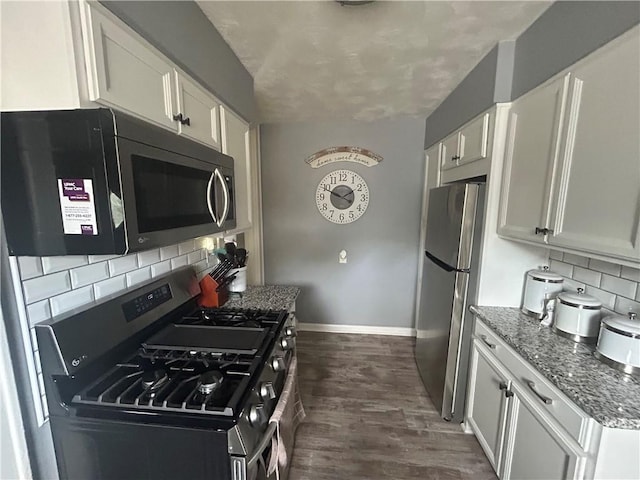 4735 Stanton Ave, Stanton Heights, PA 15201 - kitchen featuring stainless steel appliances, decorative backsplash, white cabinets, and baseboards