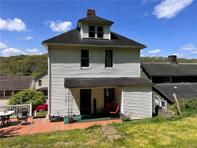 534 Broadway St, Masontown, PA 15461 - rear view of property with a deck, a lawn, and a chimney