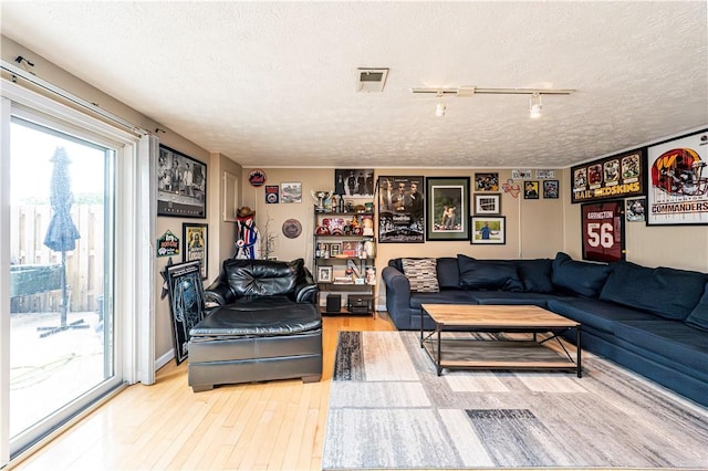 101 Canyon Ct, Unity Twp, PA 15650 - living area featuring a textured ceiling and wood finished floors