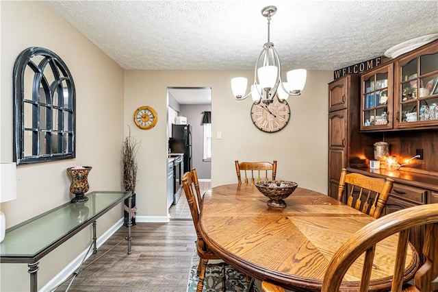 101 Canyon Ct, Unity Twp, PA 15650 - dining room with a textured ceiling, dark wood finished floors, and a chandelier