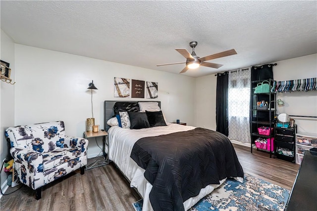 101 Canyon Ct, Unity Twp, PA 15650 - bedroom featuring wood finished floors, a ceiling fan, and a textured ceiling