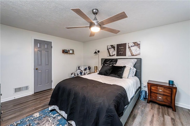 101 Canyon Ct, Unity Twp, PA 15650 - bedroom featuring wood finished floors, baseboards, a textured ceiling, and ceiling fan