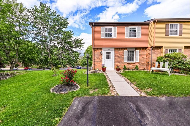 101 Canyon Ct, Unity Twp, PA 15650 - colonial home featuring a front lawn and brick siding