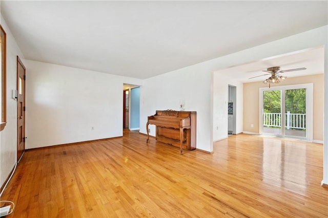 34 Eichelberger Dr, Robinson Twp Nwa, PA 15108 - unfurnished living room featuring light wood-style flooring, a ceiling fan, and baseboards