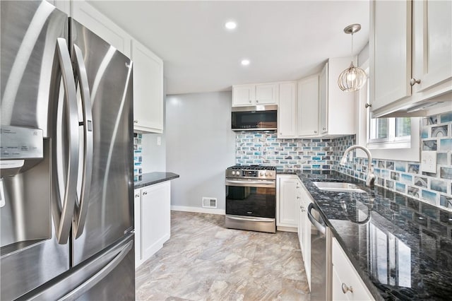 34 Eichelberger Dr, Robinson Twp Nwa, PA 15108 - kitchen featuring appliances with stainless steel finishes, a sink, tasteful backsplash, white cabinetry, and dark stone counters