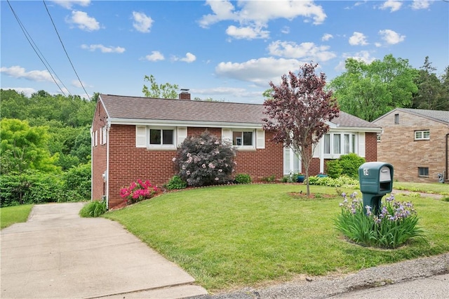 34 Eichelberger Dr, Robinson Twp Nwa, PA 15108 - view of front of house featuring brick siding, a chimney, and a front lawn