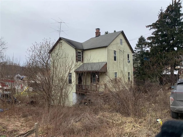 1647 Iselin Rd, Conemaugh/Young Twps Ind, PA 15681 - view of property exterior with a chimney and a shingled roof