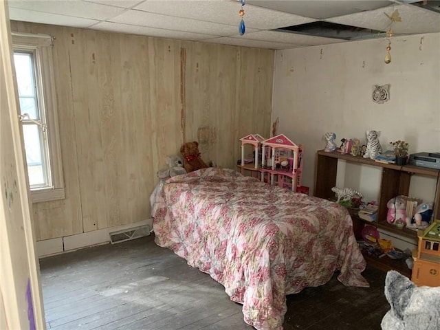 1647 Iselin Rd, Conemaugh/Young Twps Ind, PA 15681 - bedroom featuring wood walls, hardwood / wood-style floors, multiple windows, and a drop ceiling