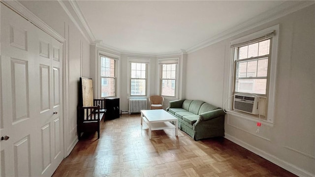 144 N Dithridge St Unit 703, Oakland, PA 15213 - living area featuring radiator heating unit, plenty of natural light, crown molding, and baseboards