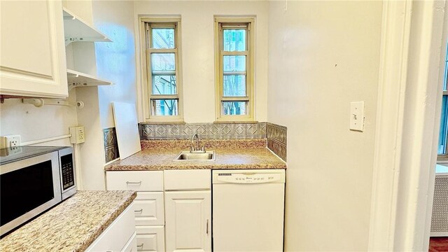 144 N Dithridge St Unit 703, Oakland, PA 15213 - kitchen featuring white dishwasher, stainless steel microwave, a sink, backsplash, and white cabinets