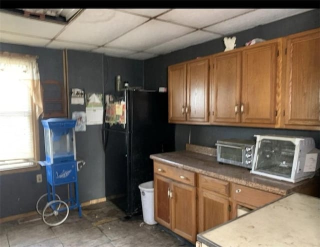 1649 Iselin Rd, Conemaugh/Young Twps Ind, PA 15681 - kitchen with a paneled ceiling, brown cabinets, freestanding refrigerator, and light countertops