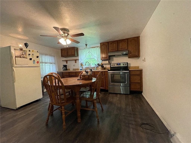 141 Minich Rd, Center Twp But, PA 16001 - kitchen with stainless steel electric stove, freestanding refrigerator, under cabinet range hood, baseboards, and dark wood-style floors