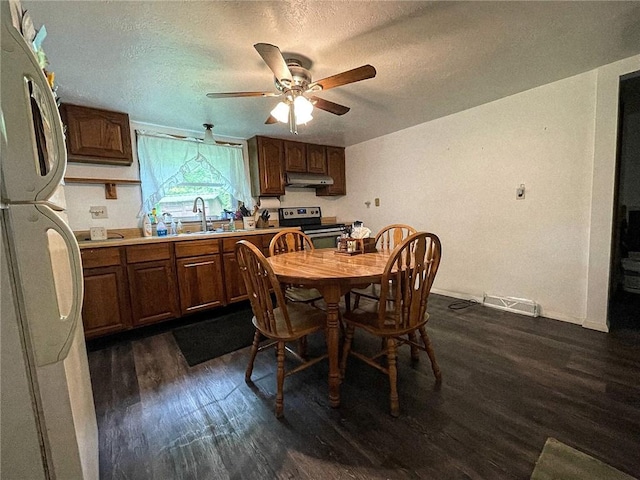 141 Minich Rd, Center Twp But, PA 16001 - dining space with dark wood-style floors, a ceiling fan, baseboards, and a textured ceiling