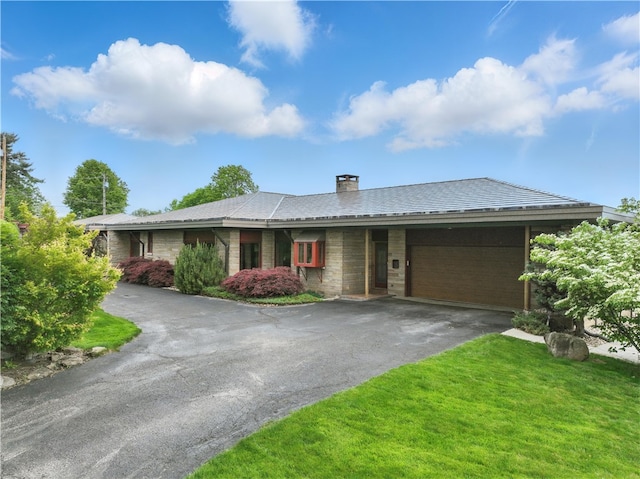 107 Belmont Cir, Uniontown, PA 15401 - ranch-style house with asphalt driveway, a garage, a front lawn, and a chimney