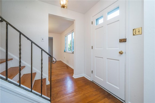 2443 Rose Garden Rd, Banksville/Westwood, PA 15220 - foyer featuring stairs, plenty of natural light, wood finished floors, and baseboards