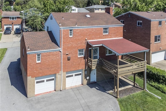 2443 Rose Garden Rd, Banksville/Westwood, PA 15220 - back of house featuring brick siding, roof with shingles, a garage, and asphalt driveway