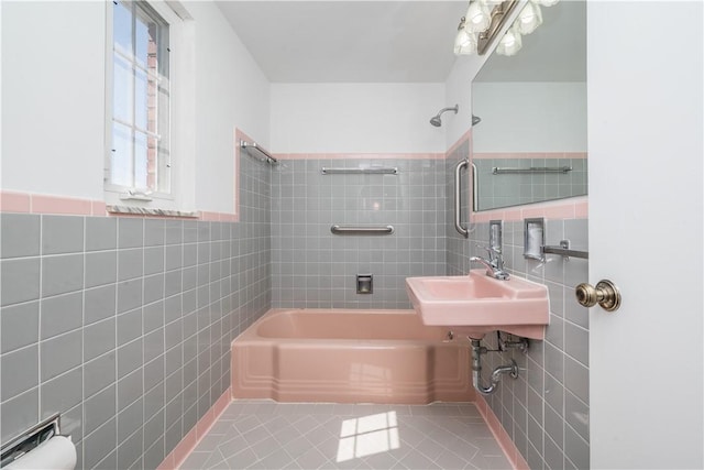 2443 Rose Garden Rd, Banksville/Westwood, PA 15220 - bathroom with tile walls, shower / bathtub combination, tile patterned floors, a sink, and a wainscoted wall