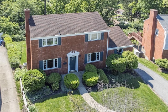 2443 Rose Garden Rd, Banksville/Westwood, PA 15220 - colonial home with a chimney, central AC unit, and brick siding