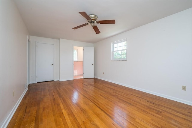 2443 Rose Garden Rd, Banksville/Westwood, PA 15220 - unfurnished bedroom with light wood-style floors, baseboards, and ceiling fan