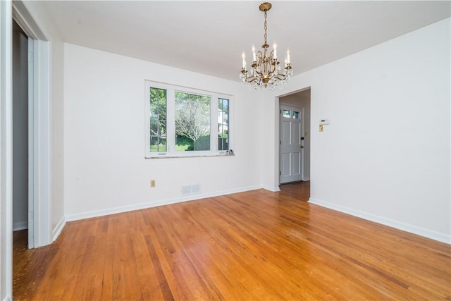 2443 Rose Garden Rd, Banksville/Westwood, PA 15220 - spare room featuring a chandelier, light wood finished floors, and baseboards