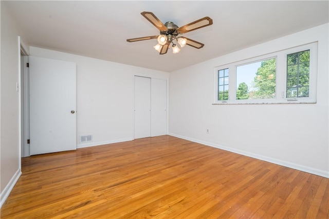 2443 Rose Garden Rd, Banksville/Westwood, PA 15220 - unfurnished bedroom featuring light wood finished floors, baseboards, a closet, and a ceiling fan