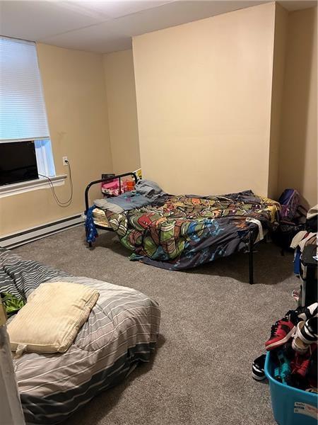 1015 Gerritt St, Homewood-Brushton, PA 15208 - bedroom with baseboard heating, carpet, and cooling unit