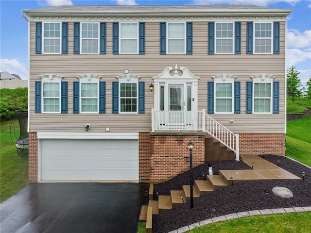 11572 Salerno Dr, North Huntingdon, PA 15642 - view of front facade with an attached garage and driveway
