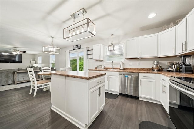 11572 Salerno Dr, North Huntingdon, PA 15642 - kitchen with appliances with stainless steel finishes, ceiling fan, dark wood-style floors, white cabinets, and recessed lighting
