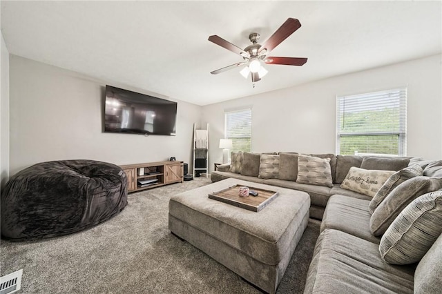 11572 Salerno Dr, North Huntingdon, PA 15642 - carpeted living area featuring plenty of natural light and a ceiling fan