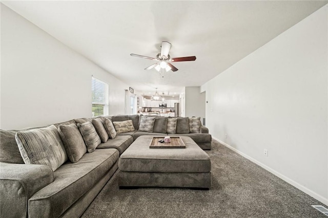 11572 Salerno Dr, North Huntingdon, PA 15642 - living room with ceiling fan, baseboards, and carpet flooring