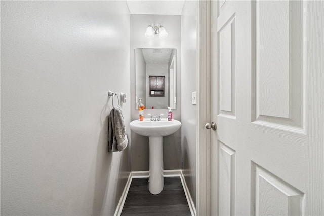 11572 Salerno Dr, North Huntingdon, PA 15642 - bathroom with wood finished floors, baseboards, and a sink