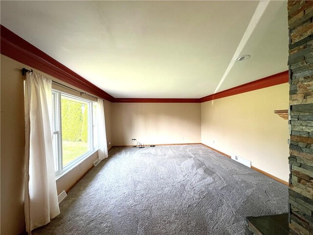122 E Elizabeth St, New Castle/2Nd, PA 16105 - unfurnished living room with carpet, baseboards, a stone fireplace, and crown molding