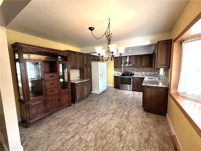 122 E Elizabeth St, New Castle/2Nd, PA 16105 - kitchen with stainless steel range with electric stovetop, white refrigerator with ice dispenser, wall chimney range hood, a chandelier, and dark brown cabinets