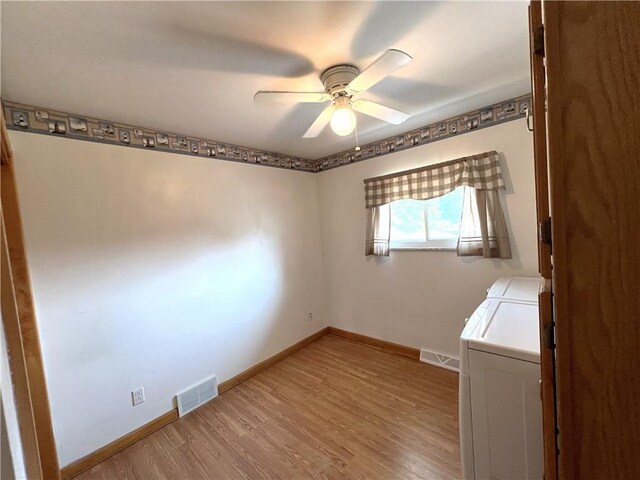 122 E Elizabeth St, New Castle/2Nd, PA 16105 - unfurnished room with washing machine and clothes dryer, a ceiling fan, baseboards, and wood finished floors