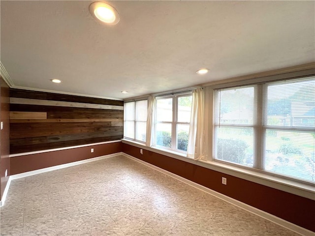 122 E Elizabeth St, New Castle/2Nd, PA 16105 - spare room featuring wooden walls, baseboards, crown molding, tile patterned floors, and recessed lighting