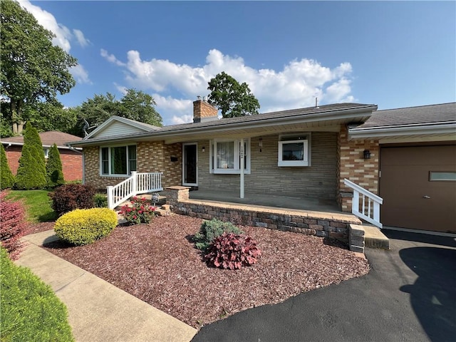 122 E Elizabeth St, New Castle/2Nd, PA 16105 - ranch-style home featuring covered porch, brick siding, and a chimney