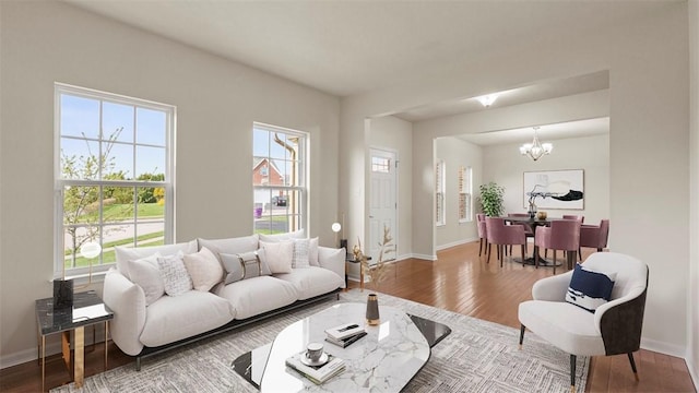 5 Heather Ct, Plum Boro, PA 15239 - living room featuring a chandelier, wood finished floors, and baseboards