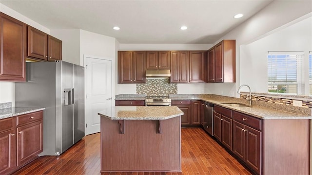 5 Heather Ct, Plum Boro, PA 15239 - kitchen with a sink, appliances with stainless steel finishes, under cabinet range hood, dark wood finished floors, and decorative backsplash
