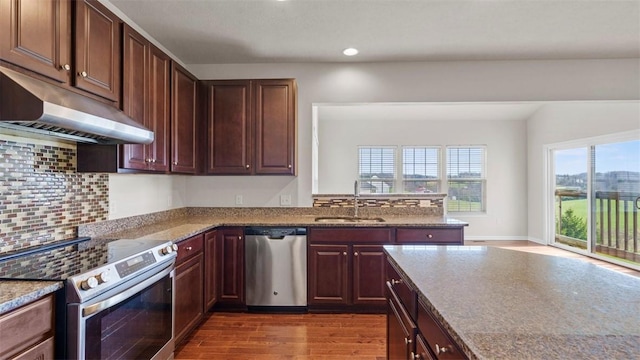 5 Heather Ct, Plum Boro, PA 15239 - kitchen featuring stainless steel appliances, a sink, under cabinet range hood, dark wood-type flooring, and decorative backsplash
