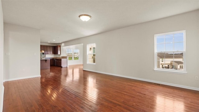 5 Heather Ct, Plum Boro, PA 15239 - unfurnished living room with dark wood-style floors and baseboards