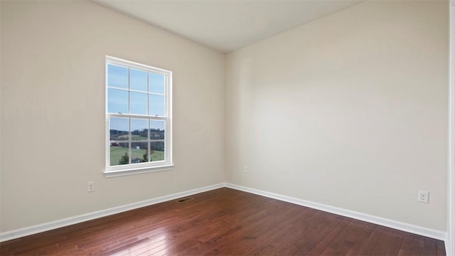 5 Heather Ct, Plum Boro, PA 15239 - spare room with dark wood-style flooring, baseboards, and healthy amount of natural light