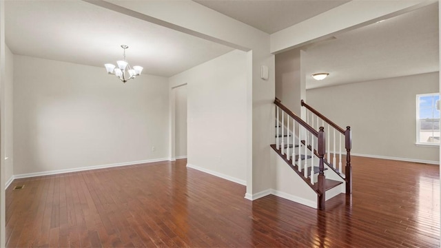 5 Heather Ct, Plum Boro, PA 15239 - empty room featuring a chandelier, wood finished floors, and baseboards