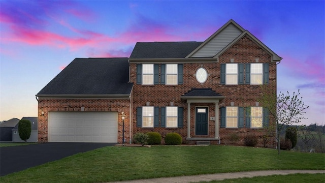 5 Heather Ct, Plum Boro, PA 15239 - colonial home with brick siding, driveway, a yard, and an attached garage