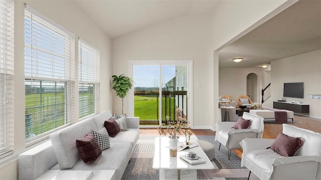5 Heather Ct, Plum Boro, PA 15239 - living room featuring arched walkways, wood finished floors, and lofted ceiling