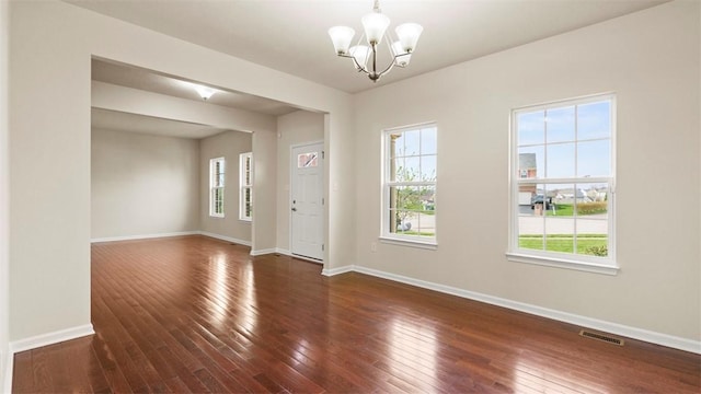 5 Heather Ct, Plum Boro, PA 15239 - spare room featuring a chandelier, wood-type flooring, and baseboards