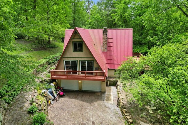 798 Cross Creek Rd, Avella, PA 15021 - a-frame home with a garage, dirt driveway, a chimney, metal roof, and a deck