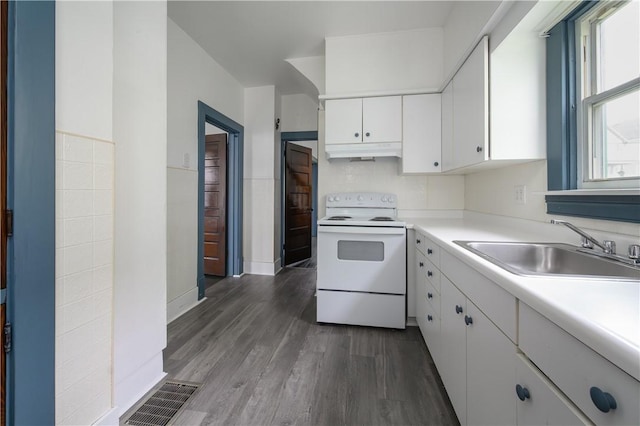 920 Roup Ave, Brackenridge, PA 15014 - kitchen with white electric range oven, a sink, under cabinet range hood, white cabinets, and dark wood-style floors