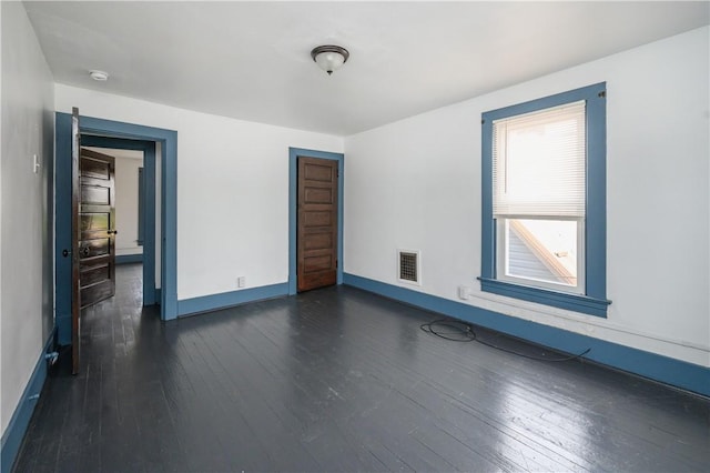920 Roup Ave, Brackenridge, PA 15014 - unfurnished room with dark wood-style floors and baseboards